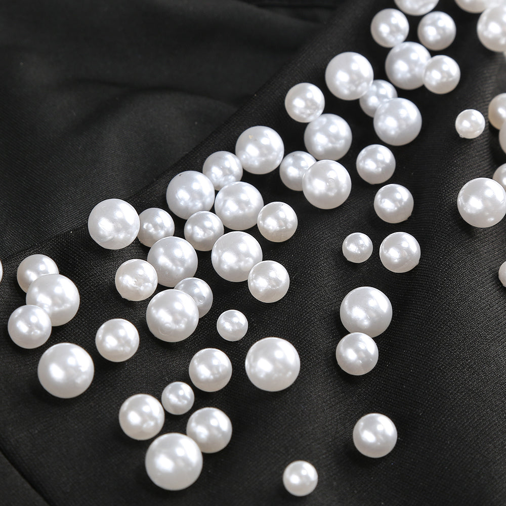 abito senza spalline decorato con perle in nero