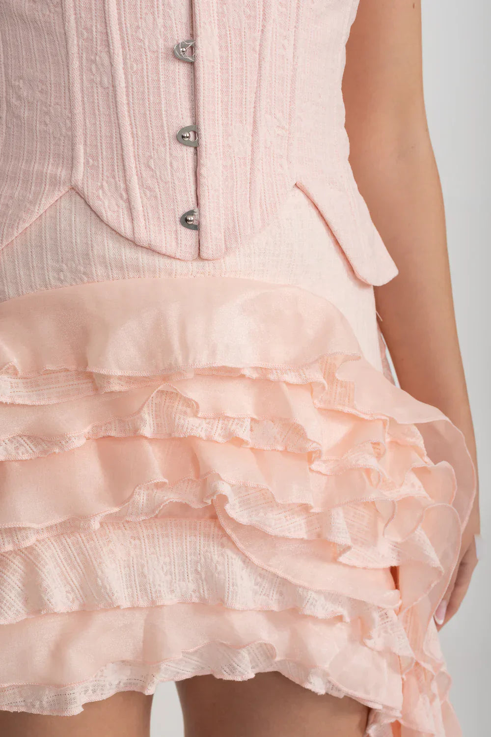 Vintage Inspired Corset Dress With Ruched Bustier And Flowing Ruffled Side Details - Pink