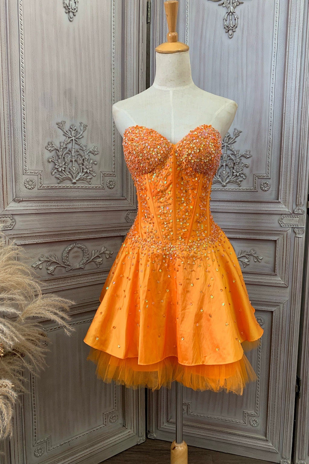 Orange taffeta strapless beaded evening gown