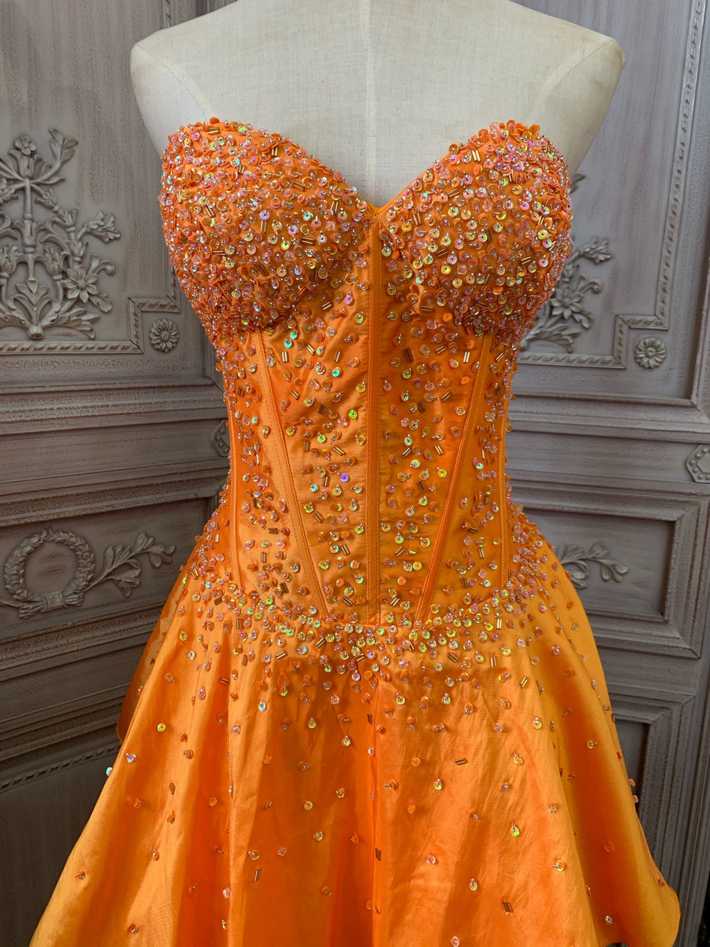 Orange taffeta strapless beaded evening gown