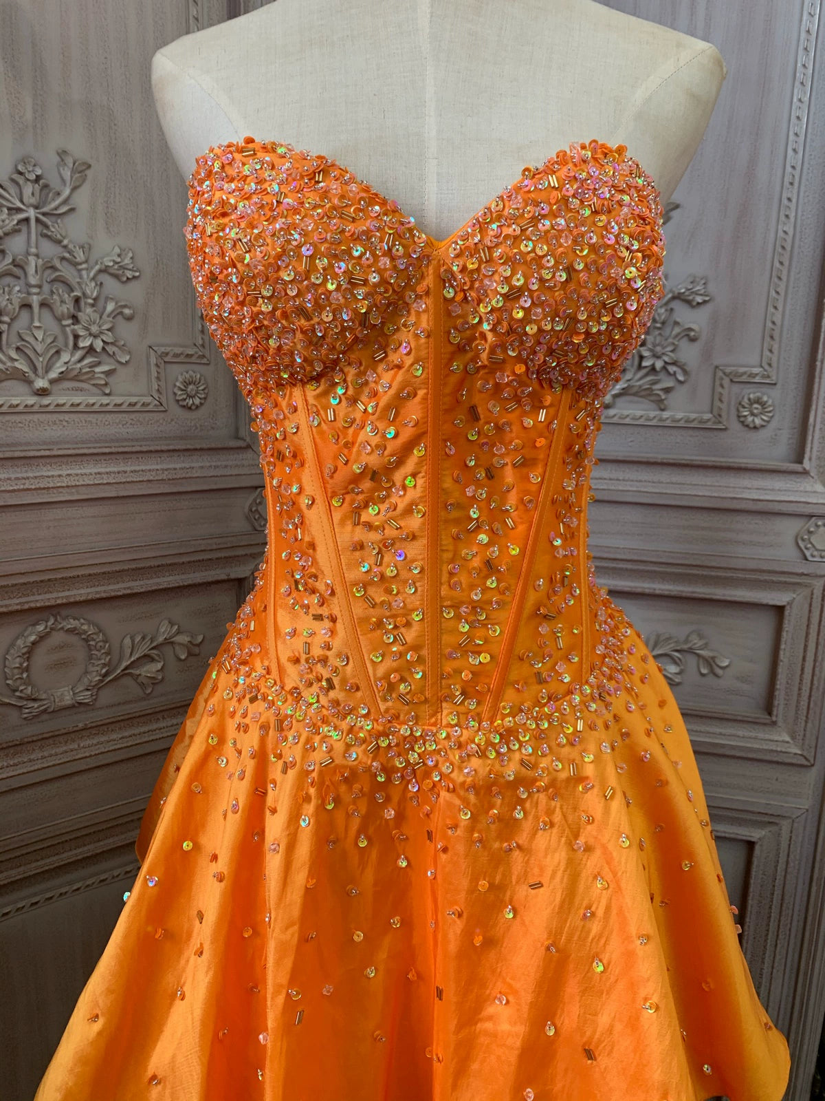 Orange taffeta strapless beaded evening gown