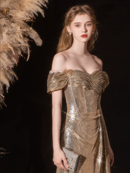 Gold sequined pleated strapless fishtail gown