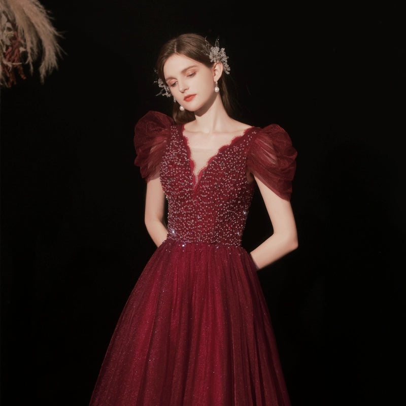 lura sequin v-neck puff short sleeve maxi dress in claret
