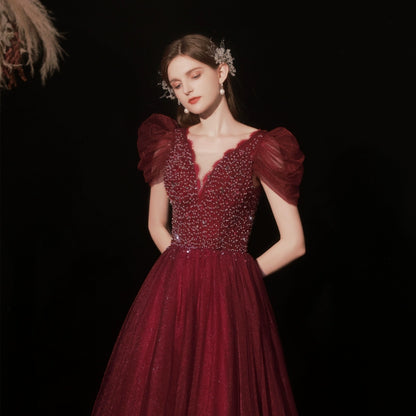 lura sequin v-neck puff short sleeve maxi dress in claret