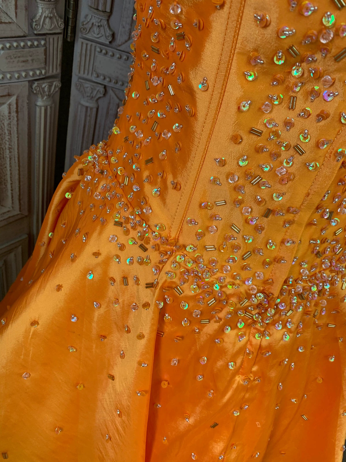 Orange taffeta strapless beaded evening gown