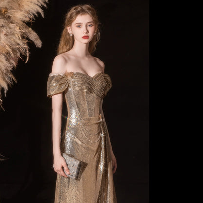 Gold sequined pleated strapless fishtail gown
