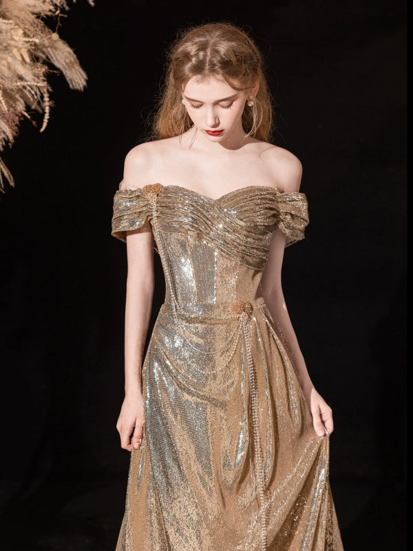 Gold sequined pleated strapless fishtail gown