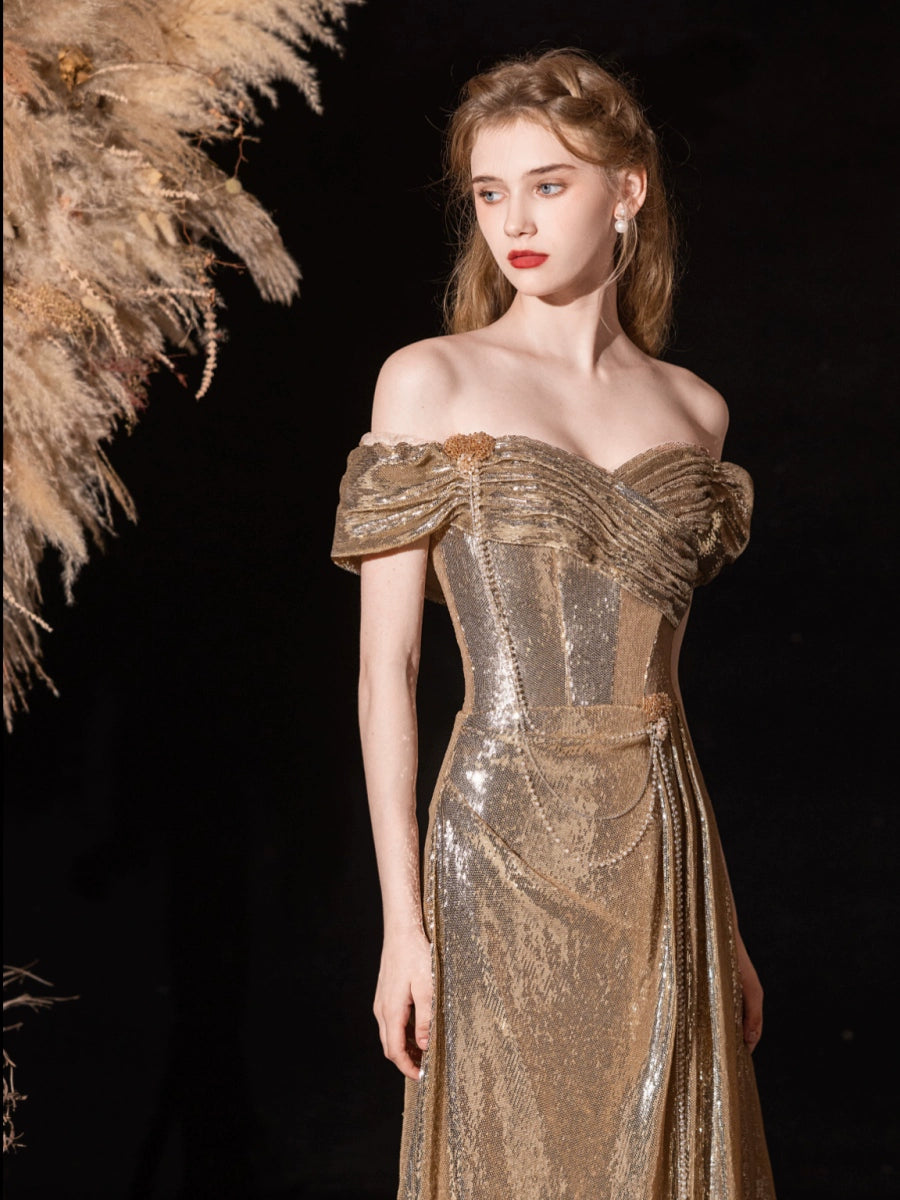Gold sequined pleated strapless fishtail gown