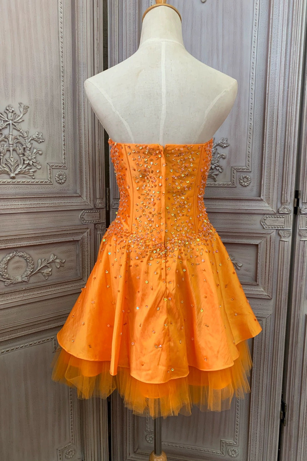 Orange taffeta strapless beaded evening gown