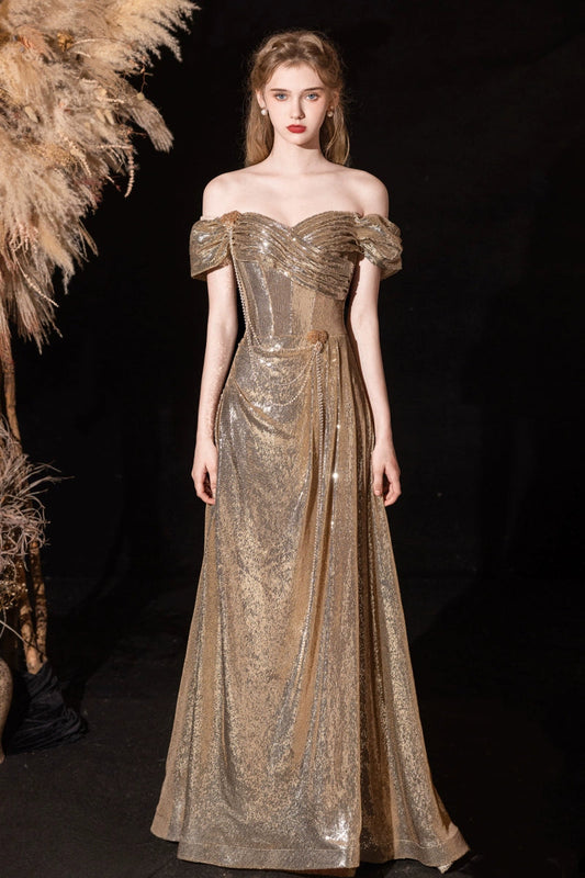 Gold sequined pleated strapless fishtail gown