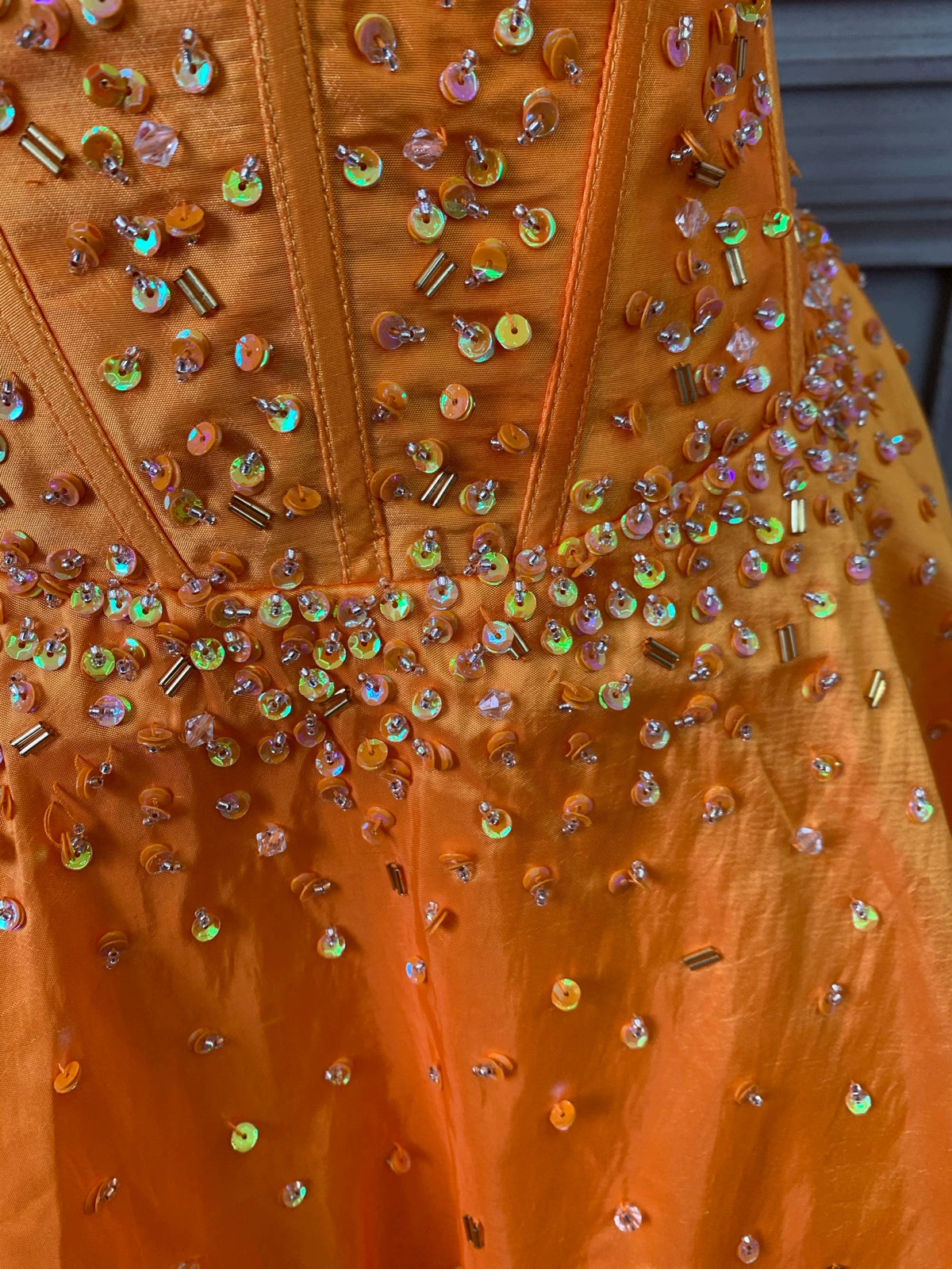 Orange taffeta strapless beaded evening gown