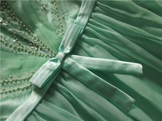 Green chiffon long beaded evening gown