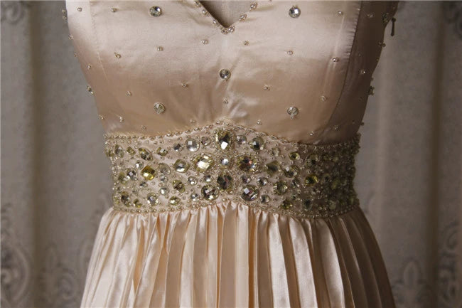 Champagne color pleated beaded evening gown