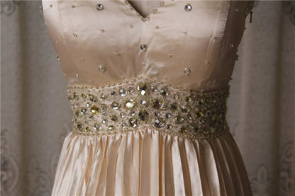 Champagne color pleated beaded evening gown