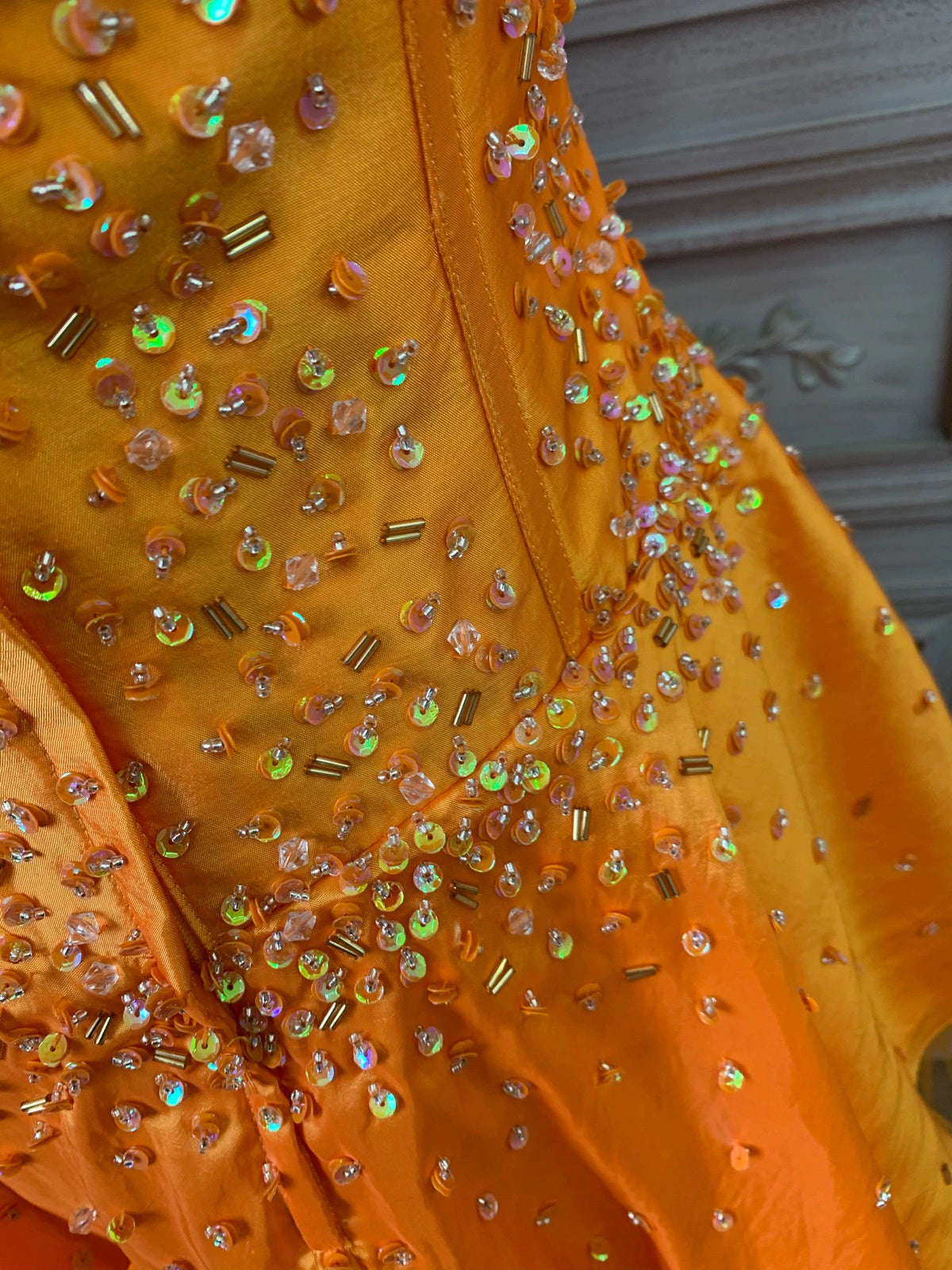 Orange taffeta strapless beaded evening gown