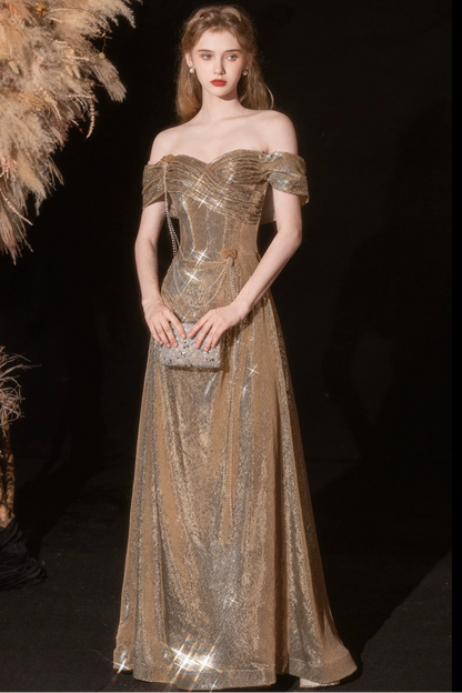 Gold sequined pleated strapless fishtail gown