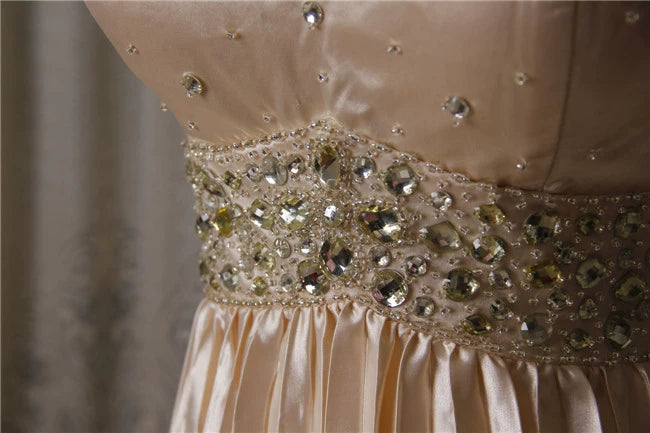 Champagne color pleated beaded evening gown