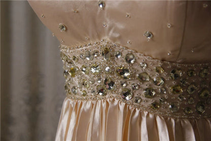 Champagne color pleated beaded evening gown