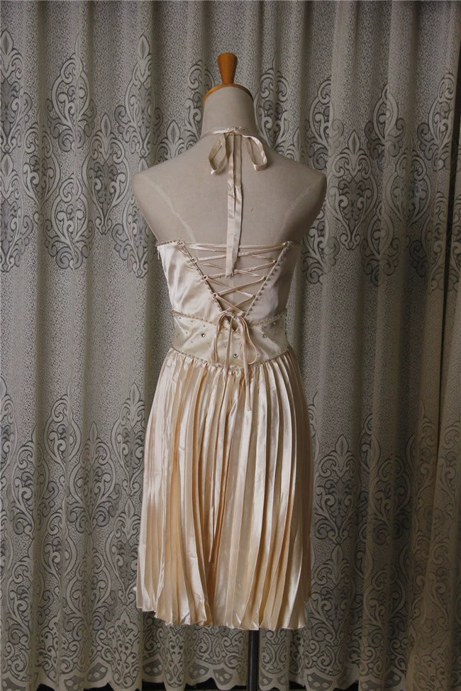 Champagne color pleated beaded evening gown