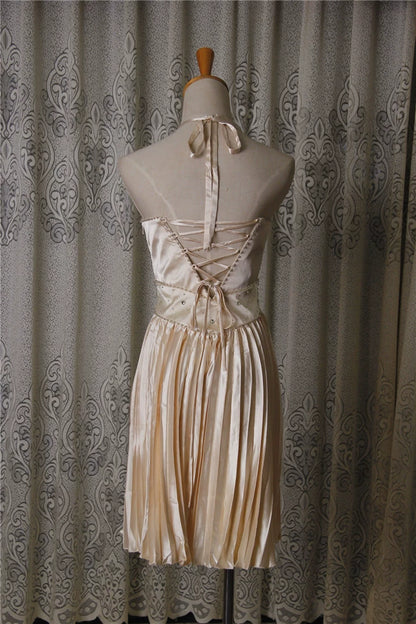 Champagne color pleated beaded evening gown