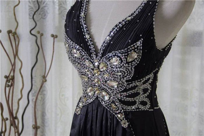 Black satin backless evening gown with ties