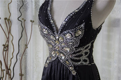 Black satin backless evening gown with ties
