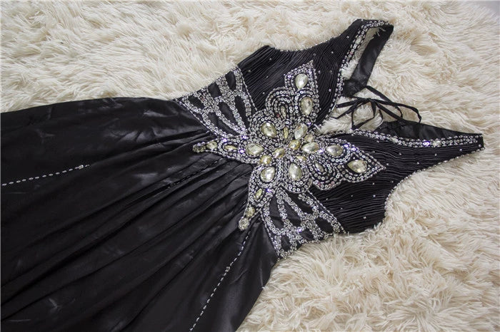 Black satin backless evening gown with ties