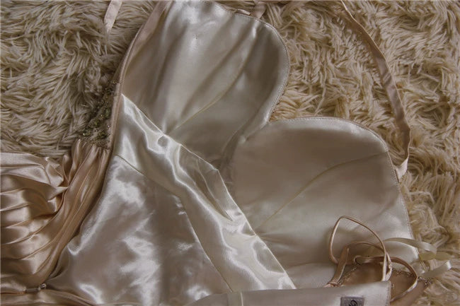 Champagne color pleated beaded evening gown