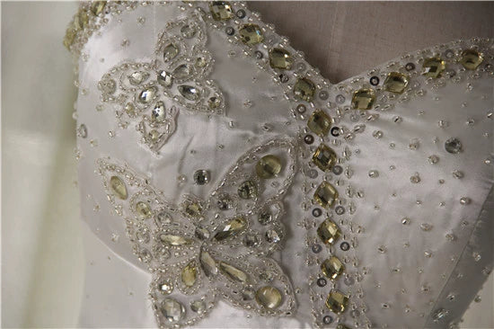 White brocade fishtail evening gown with back straps