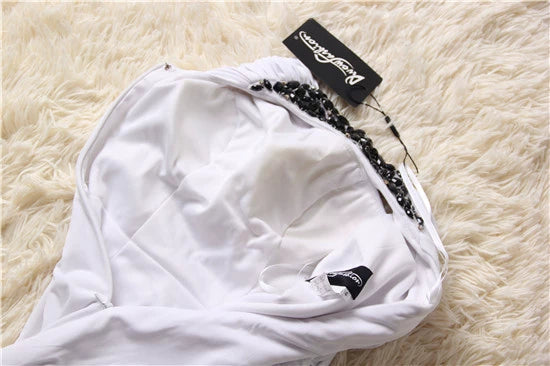 Mini abito da sera monospalla in maglia elasticizzata bianca